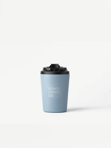 Made by Fressko reusable cup, with BENCH COFFEE CO. logo, in blue