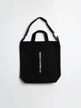 Load image into Gallery viewer, BAGGU tote bag in black, with BENCH COFFEE CO. logo
