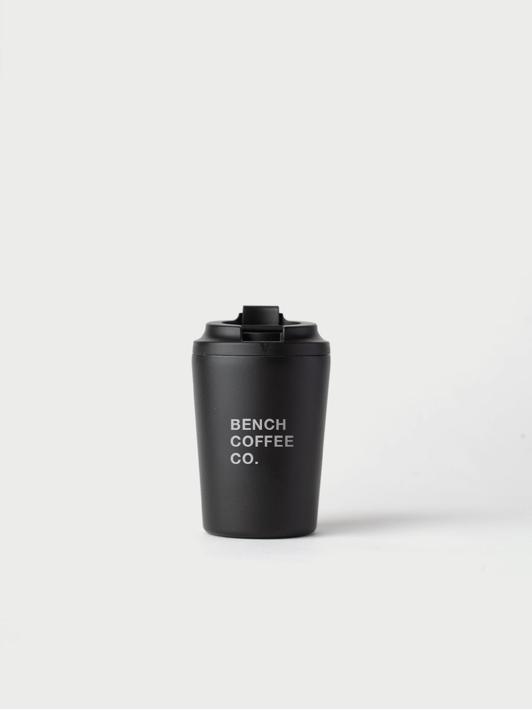 Made by Fressko reusable cup, with BENCH COFFEE CO. logo, in black